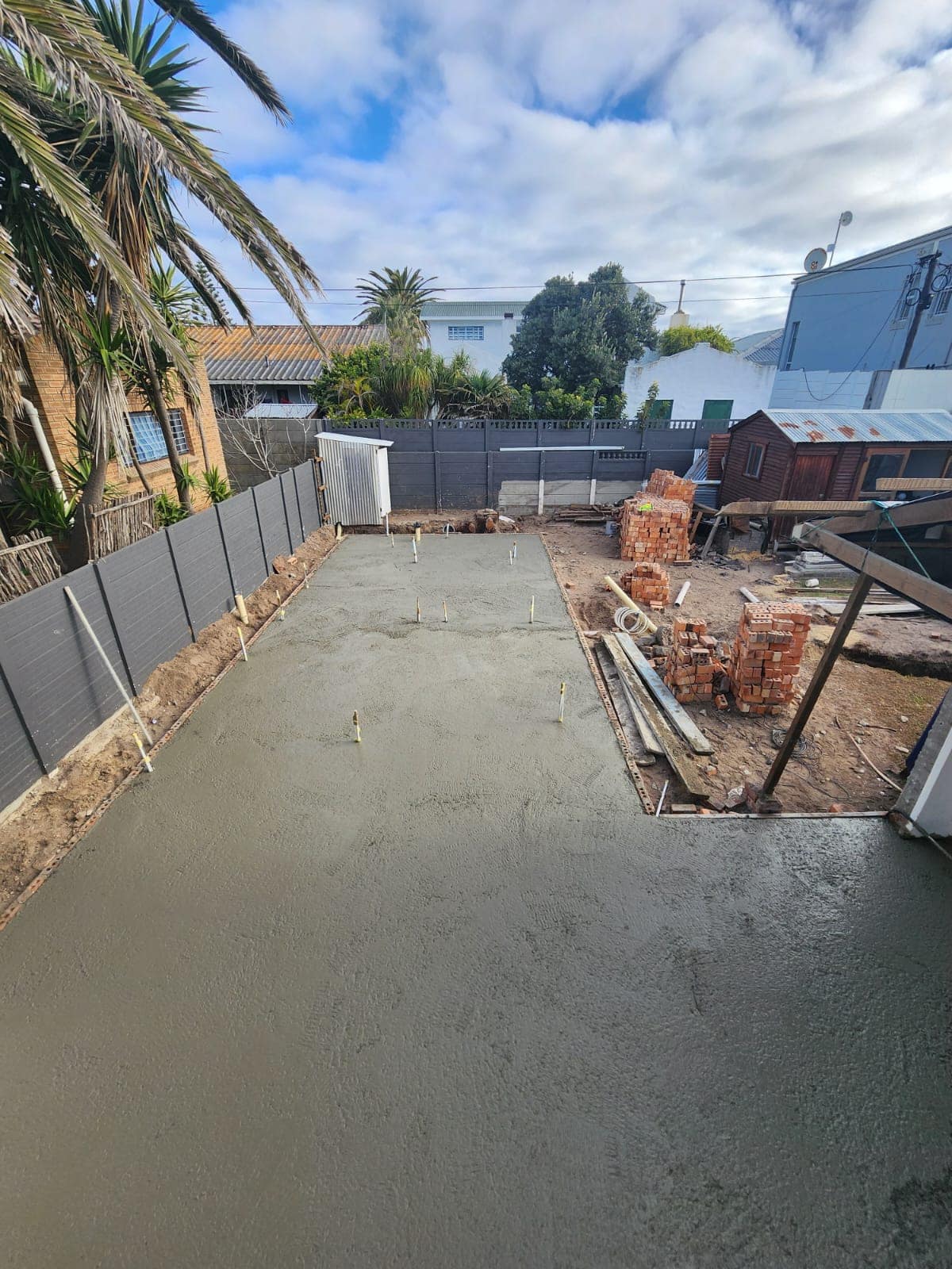 Freshly cast and floated concrete surface bed
